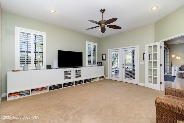 897 Yellow Wood Ct SE, Palm Bay, FL 32909 - carpeted living room featuring french doors, baseboards, a ceiling fan, and recessed lighting