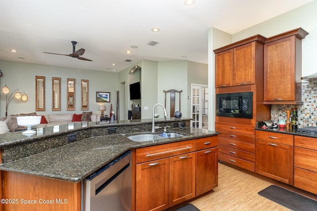 897 Yellow Wood Ct SE, Palm Bay, FL 32909 - kitchen featuring black microwave, open floor plan, visible vents, stainless steel dishwasher, and a sink