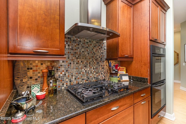 897 Yellow Wood Ct SE, Palm Bay, FL 32909 - kitchen with tasteful backsplash, baseboards, black appliances, dark stone counters, and island exhaust hood
