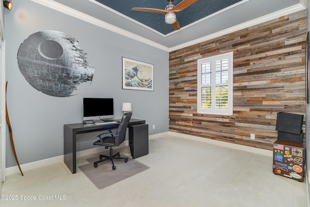 897 Yellow Wood Ct SE, Palm Bay, FL 32909 - carpeted home office with baseboards, ornamental molding, wooden walls, a ceiling fan, and an accent wall