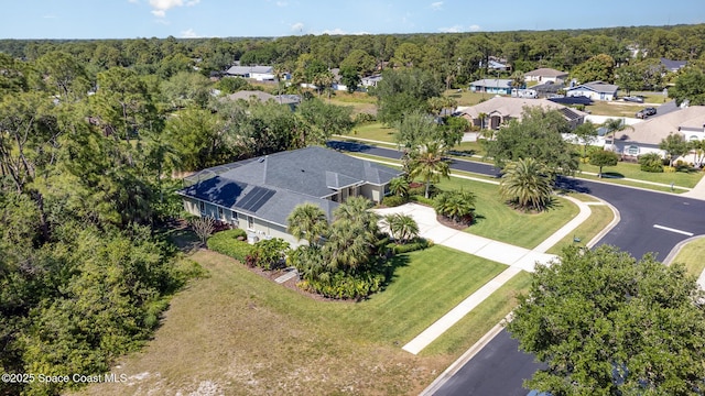 897 Yellow Wood Ct SE, Palm Bay, FL 32909 - bird's eye view featuring a view of trees and a residential view