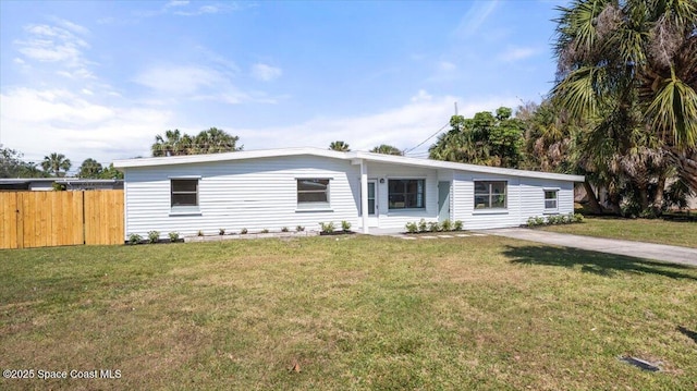 1800 Elmwood Dr, Melbourne, FL 32935 - view of front of home with fence and a front lawn