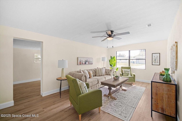 1800 Elmwood Dr, Melbourne, FL 32935 - living area with visible vents, ceiling fan, wood finished floors, and baseboards