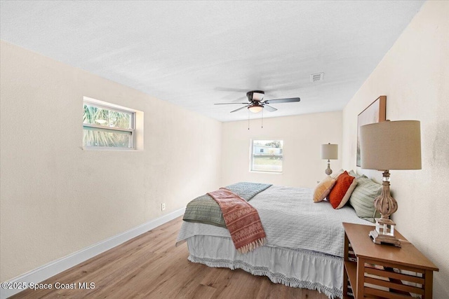 1800 Elmwood Dr, Melbourne, FL 32935 - bedroom featuring visible vents, baseboards, a ceiling fan, and wood finished floors