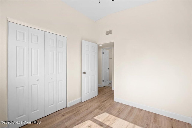 1800 Elmwood Dr, Melbourne, FL 32935 - unfurnished bedroom featuring a closet, light wood finished floors, visible vents, and baseboards