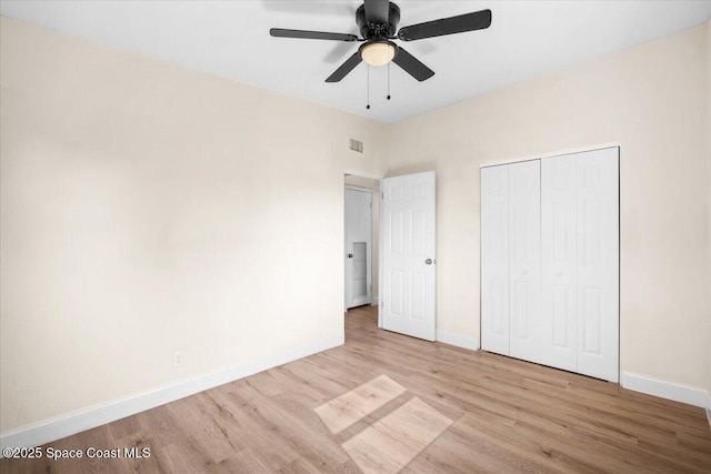 1800 Elmwood Dr, Melbourne, FL 32935 - unfurnished bedroom with a closet, baseboards, visible vents, ceiling fan, and wood finished floors