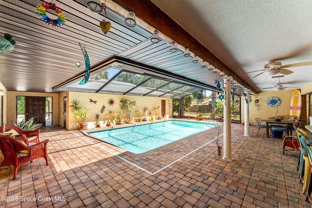 1475 S Oaks Dr, Merritt Island, FL 32952 - pool with a patio area, glass enclosure, and ceiling fan