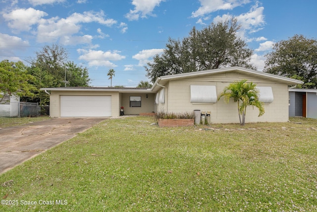 100 Barbados Dr, Merritt Island, FL 32952 - single story home featuring an attached garage, driveway, a front yard, and concrete block siding