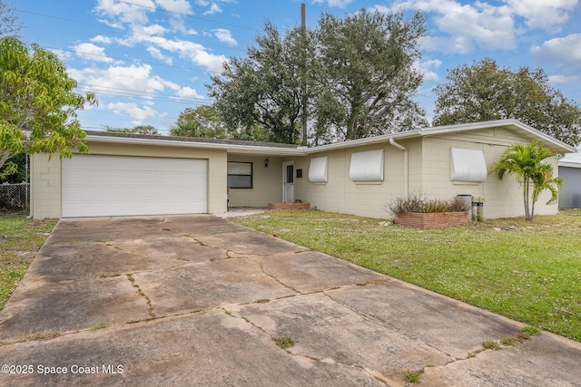 100 Barbados Dr, Merritt Island, FL 32952 - ranch-style house with concrete block siding, an attached garage, a front yard, and driveway