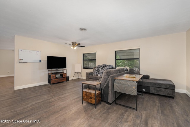 100 Barbados Dr, Merritt Island, FL 32952 - living area featuring dark wood finished floors, visible vents, a ceiling fan, and baseboards