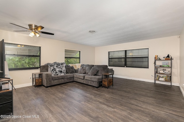100 Barbados Dr, Merritt Island, FL 32952 - living area featuring wood finished floors, a ceiling fan, and baseboards