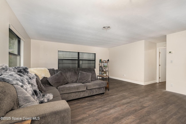 100 Barbados Dr, Merritt Island, FL 32952 - living room with wood finished floors, visible vents, and baseboards