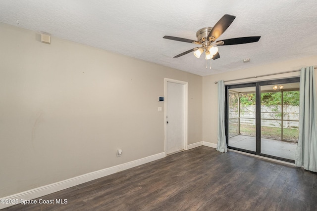 100 Barbados Dr, Merritt Island, FL 32952 - spare room featuring ceiling fan, baseboards, a textured ceiling, and dark wood-style floors