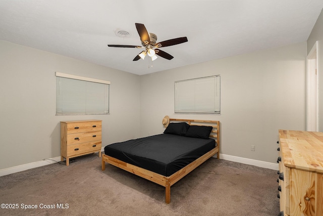 100 Barbados Dr, Merritt Island, FL 32952 - carpeted bedroom with baseboards, a ceiling fan, and visible vents