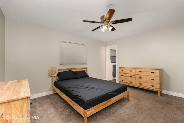 100 Barbados Dr, Merritt Island, FL 32952 - bedroom with carpet floors, a ceiling fan, and baseboards