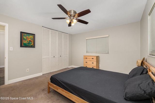 100 Barbados Dr, Merritt Island, FL 32952 - carpeted bedroom with ceiling fan, baseboards, and a closet