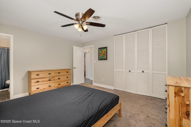 100 Barbados Dr, Merritt Island, FL 32952 - carpeted bedroom with a closet, visible vents, baseboards, and connected bathroom