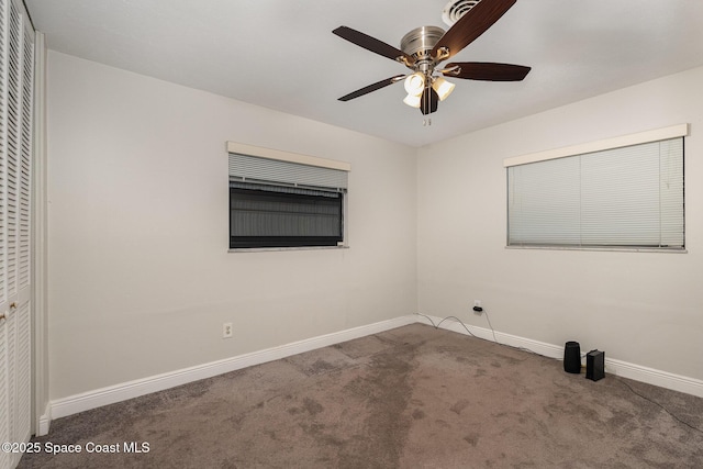 100 Barbados Dr, Merritt Island, FL 32952 - carpeted spare room featuring visible vents, baseboards, and ceiling fan