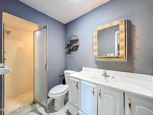 2543 Hathaway Dr, Cocoa, FL 32926 - full bathroom with a stall shower, vanity, toilet, and a textured ceiling