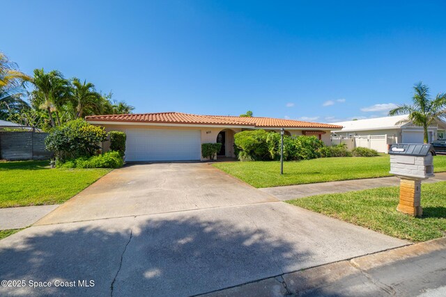ranch-style home featuring a tile roof, a garage, stucco siding, and driveway