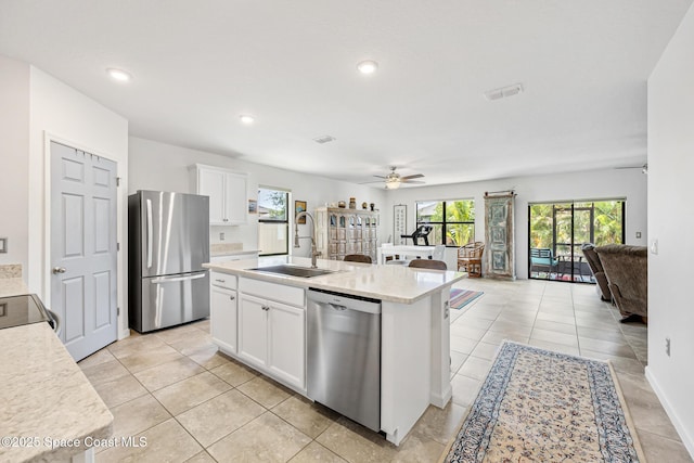 413 Catfish Pl, Cocoa, FL 32927 - kitchen featuring ceiling fan, visible vents, appliances with stainless steel finishes, a sink, and open floor plan