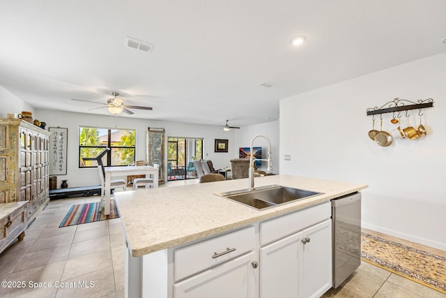 413 Catfish Pl, Cocoa, FL 32927 - kitchen featuring ceiling fan, a center island with sink, a sink, and dishwasher