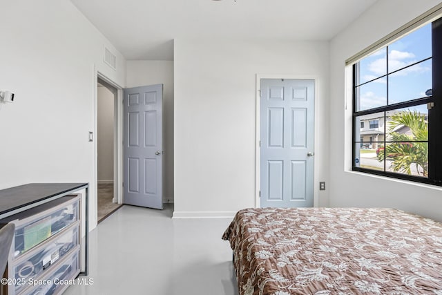 413 Catfish Pl, Cocoa, FL 32927 - bedroom featuring visible vents, concrete floors, and baseboards