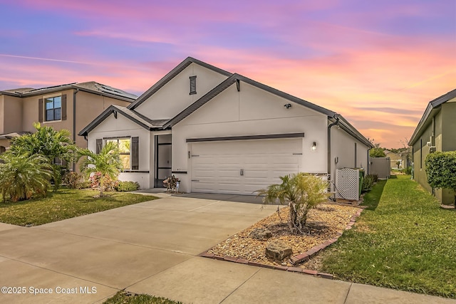 413 Catfish Pl, Cocoa, FL 32927 - ranch-style house with an attached garage, stucco siding, a yard, and concrete driveway