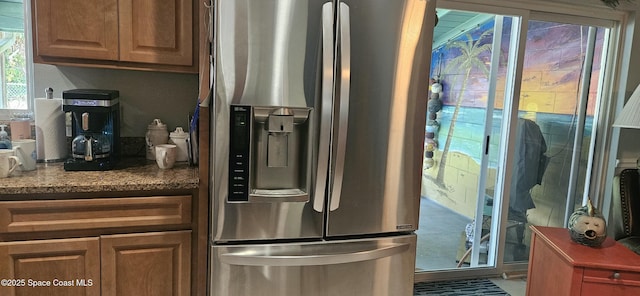 kitchen with stainless steel fridge with ice dispenser
