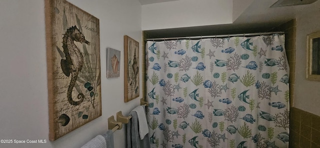 bathroom with a shower with curtain