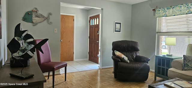 sitting room featuring baseboards