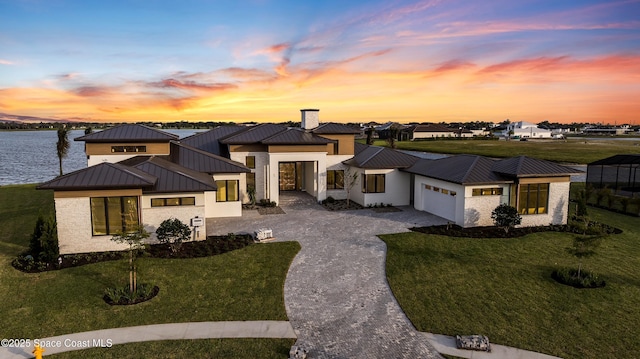 3717 Upper Floridian Way, Rockledge, FL 32955 - view of front of house featuring a standing seam roof, metal roof, and a garage