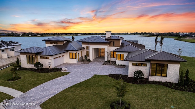 3717 Upper Floridian Way, Rockledge, FL 32955 - modern home with a standing seam roof, metal roof, and a garage