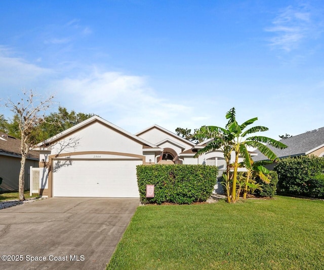 2544 Ventura Cir, Melbourne, FL 32904 - ranch-style house featuring an attached garage, stucco siding, driveway, and a front lawn
