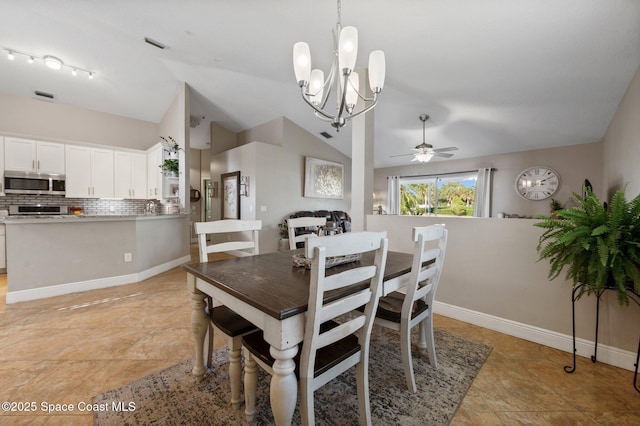2544 Ventura Cir, Melbourne, FL 32904 - dining space featuring visible vents, ceiling fan with notable chandelier, baseboards, and lofted ceiling