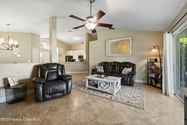 2544 Ventura Cir, Melbourne, FL 32904 - living area featuring baseboards, light tile patterned flooring, vaulted ceiling, and ceiling fan with notable chandelier