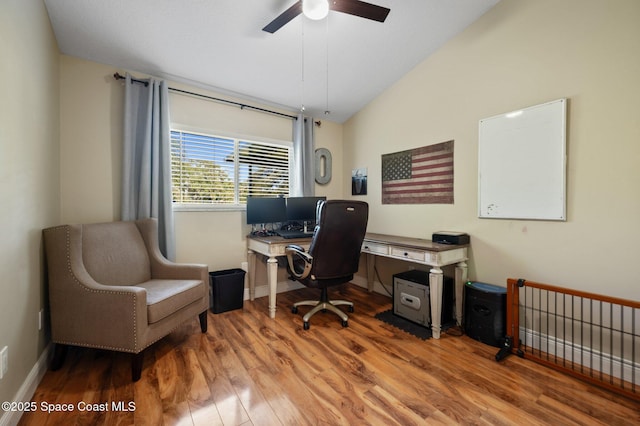 2544 Ventura Cir, Melbourne, FL 32904 - office featuring baseboards, a ceiling fan, vaulted ceiling, and wood finished floors