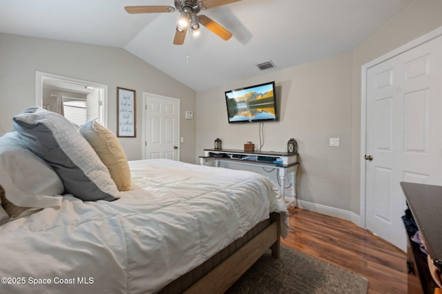 2544 Ventura Cir, Melbourne, FL 32904 - bedroom with baseboards, a ceiling fan, dark wood-type flooring, visible vents, and lofted ceiling