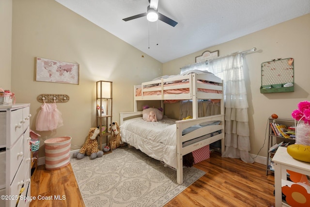 2544 Ventura Cir, Melbourne, FL 32904 - bedroom with ceiling fan, vaulted ceiling, wood finished floors, and baseboards