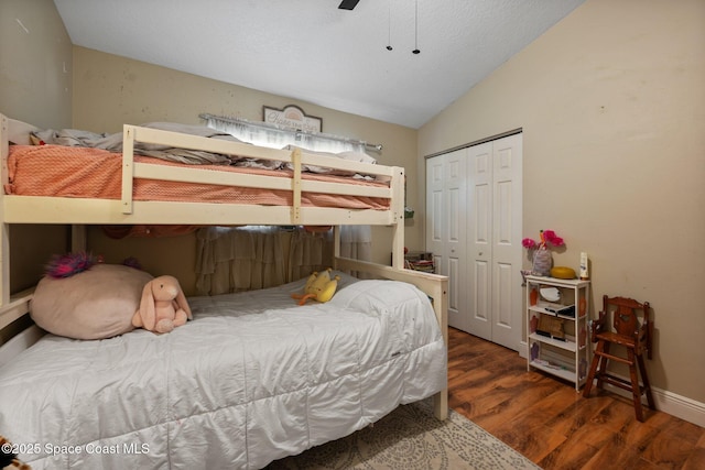 2544 Ventura Cir, Melbourne, FL 32904 - bedroom featuring ceiling fan, a closet, wood finished floors, lofted ceiling, and baseboards