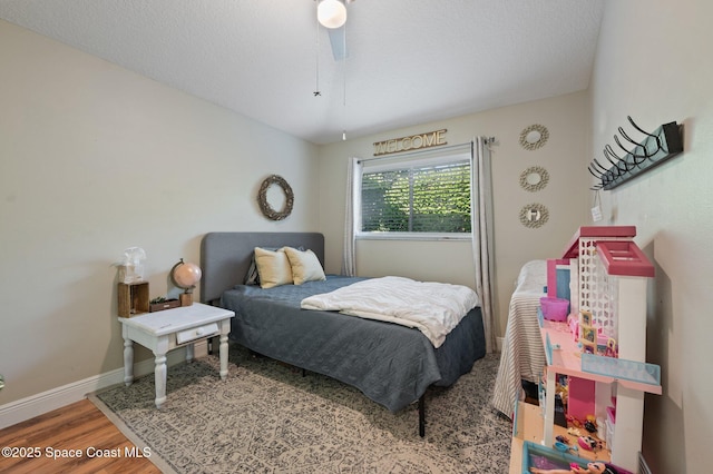 2544 Ventura Cir, Melbourne, FL 32904 - bedroom with baseboards, ceiling fan, and wood finished floors
