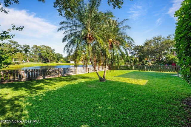2544 Ventura Cir, Melbourne, FL 32904 - view of yard featuring a water view and a fenced backyard