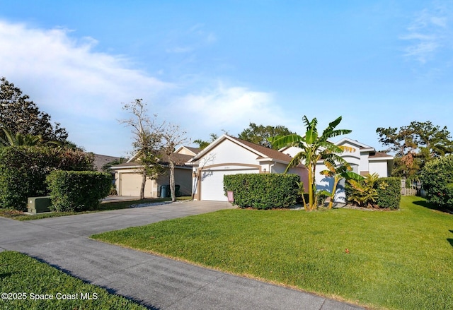 2544 Ventura Cir, Melbourne, FL 32904 - view of front of house featuring concrete driveway, an attached garage, stucco siding, and a front lawn