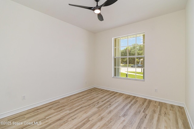 unfurnished room featuring light wood finished floors, ceiling fan, and baseboards