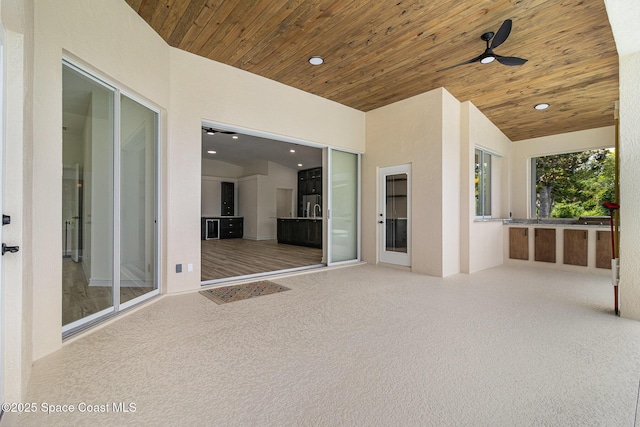 view of patio featuring ceiling fan
