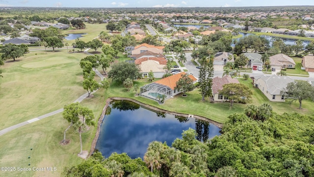 view of property location featuring nearby suburban area, a nearby body of water, and a local golf course