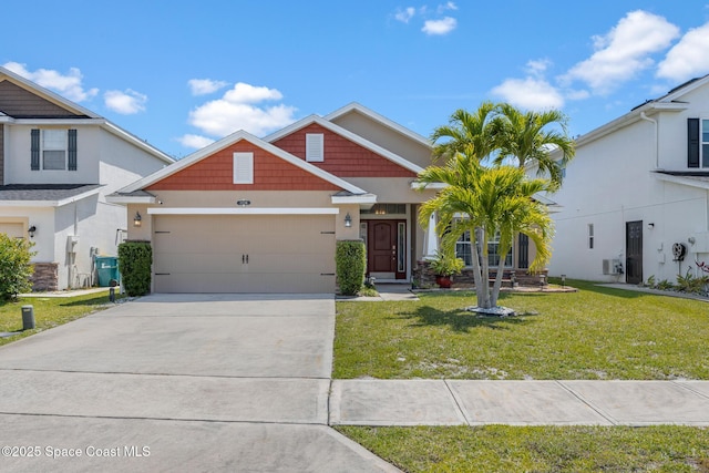 craftsman house with an attached garage, a front lawn, and concrete driveway
