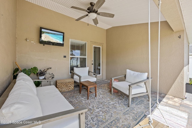 view of patio featuring an outdoor living space and a ceiling fan