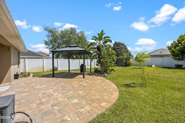 view of patio featuring a gazebo and a fenced backyard