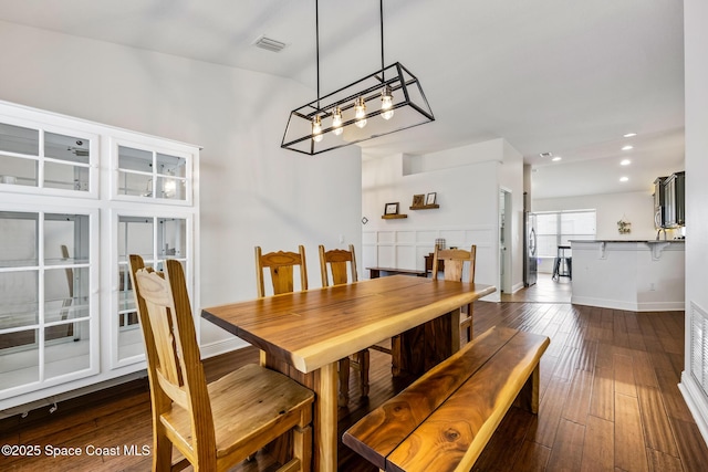 dining area with recessed lighting, dark wood finished floors, visible vents, baseboards, and a chandelier
